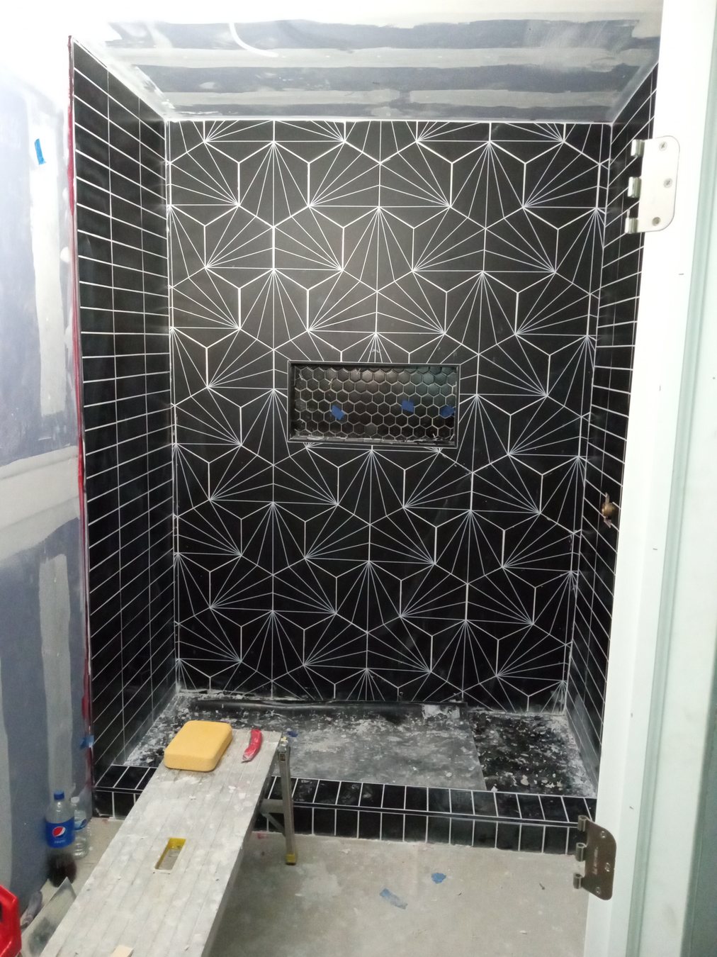Detailed tile installation in a shower area