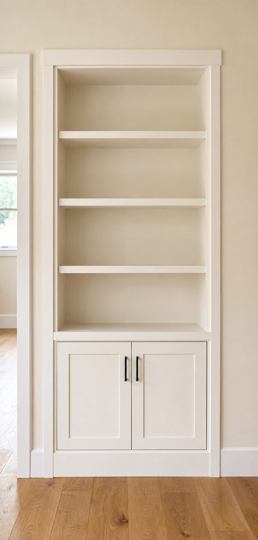 A compact finished shelving and cabinet installation.